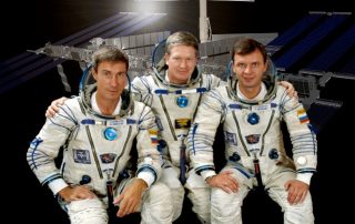 ISS Expedition One Commander William M. (Bill) Shepherd (center) is flanked by Soyuz Commander Yuri P. Gidzenko (right) and Flight Engineer Sergei K. Krikalev (left) in this crew photograph, taken during a break in training in Russia.