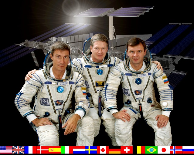 ISS Expedition One Commander William M. (Bill) Shepherd (center) is flanked by Soyuz Commander Yuri P. Gidzenko (right) and Flight Engineer Sergei K. Krikalev (left) in this crew photograph, taken during a break in training in Russia.