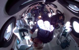 Pictured on the right is Vice President of Government Affairs at Virgin Galactic, Sirisha Bandla, activating a KFT onboard the Virgin Galactic VSS Unity.