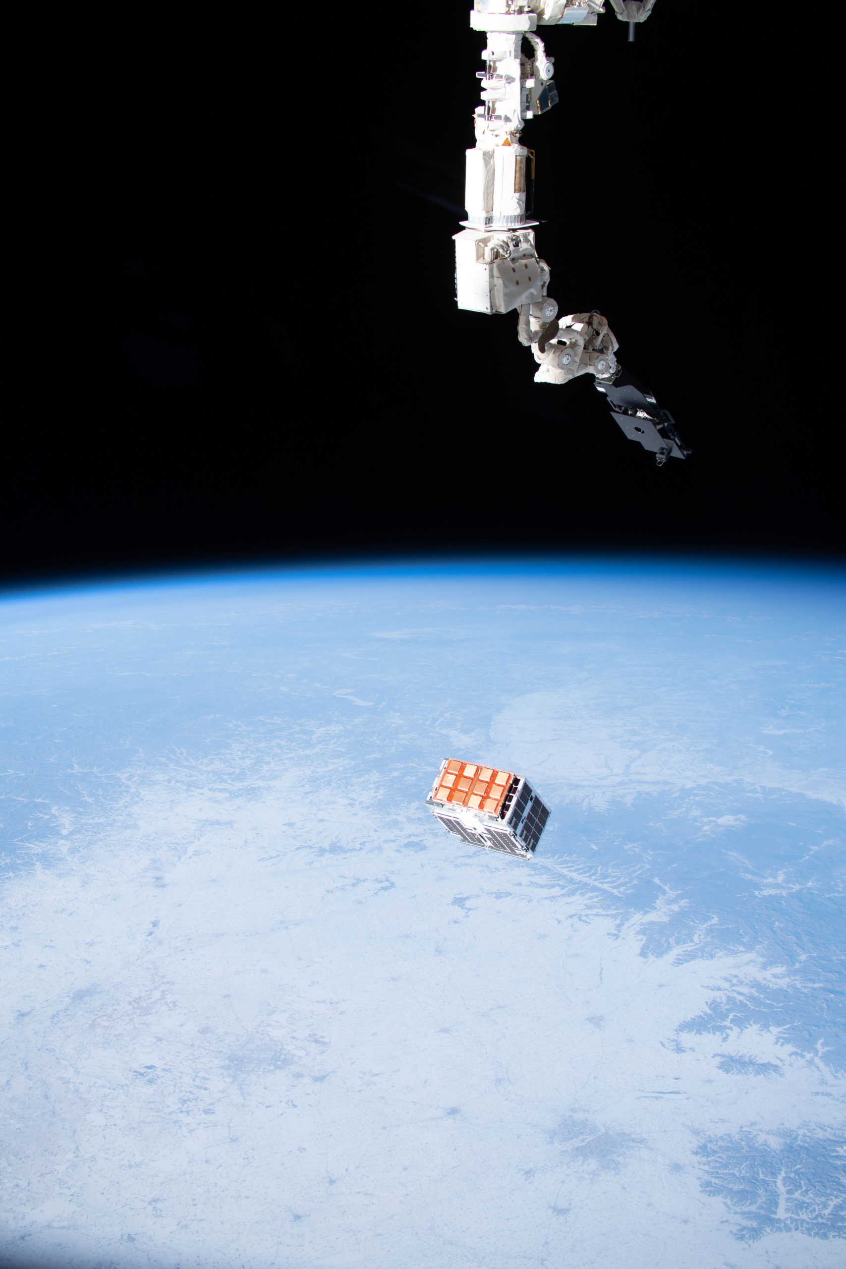 Experimental Spacecraft STPSat 4 being released into low earth orbit from SSIKLOPS (Space Station Integrated Kinetic Launcher for Orbital Payload Systems)