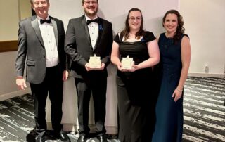RNASA Early-Career category winners, Ben Asher and Dr. Sarah Moudy, pose for a photo with their coveted trophies alongside Aegis Aerospace President, Bill Hollister and Stephanie Murphy, Principal Owner and CEO.